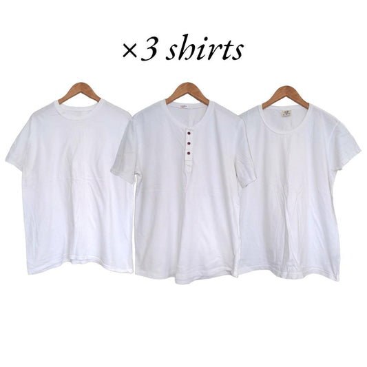 Three white t-shirts.