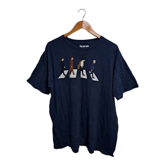 Navy blue shirt with The Beatles band crossing the road parody.